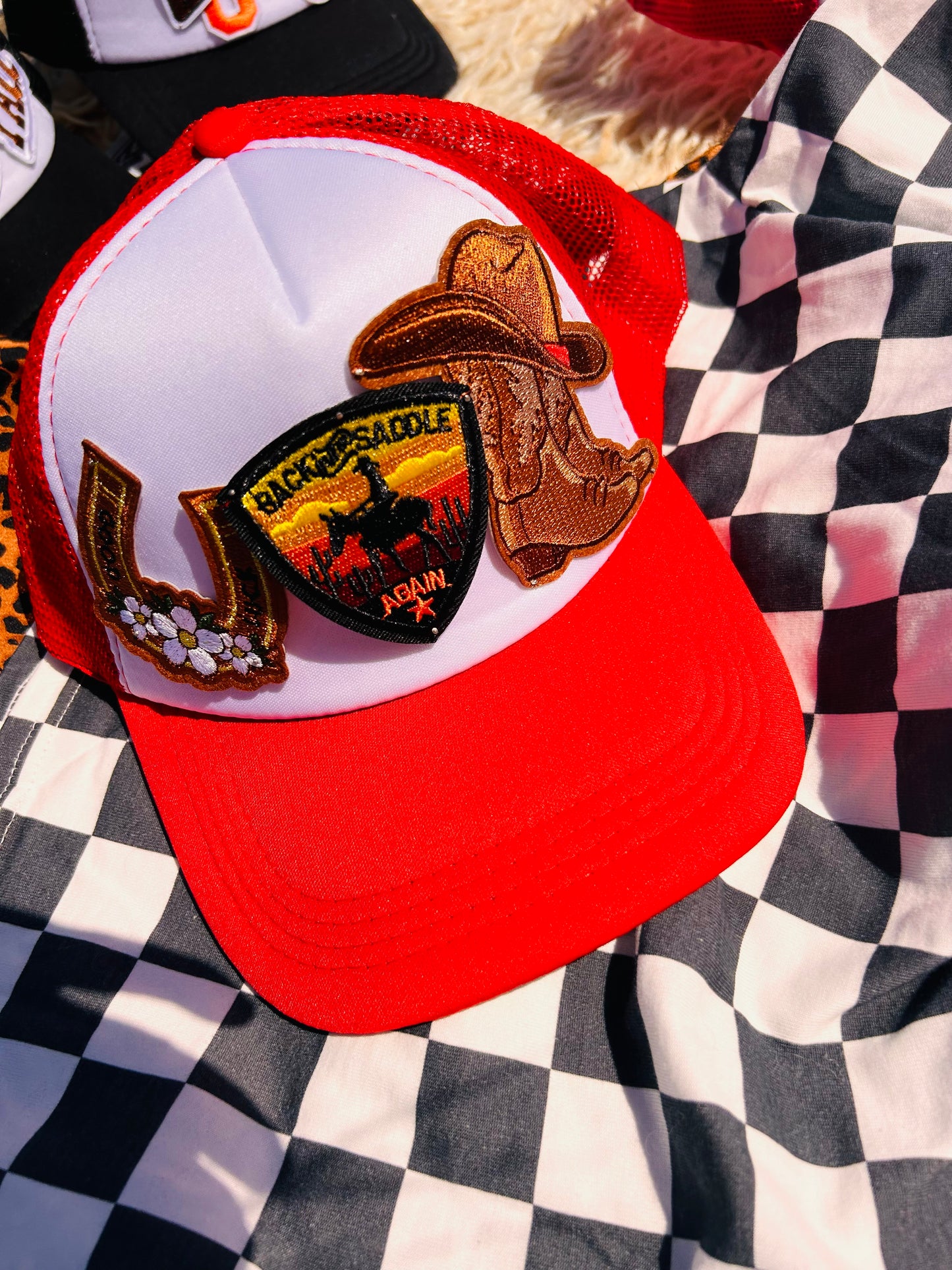 “Back in the Saddle” Trucker Hat in Red